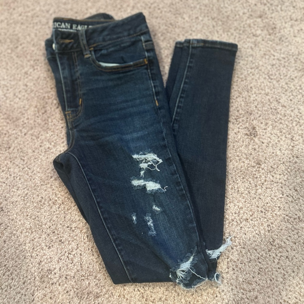 American Eagle Outfitters Women's Dark Blue Distressed high rise jeggings.